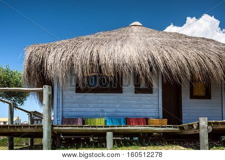 Typical brightly colored hous on the picturesque beach in Punta del Diablo popular tourist place in Uruguay