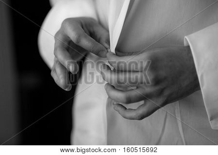 close up of a hand man how wears white shirt