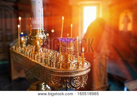 Interior Of Orthodox Church In Easter. baby christening. Ceremony of a christening in Christian church. bathing the baby into the baptismal font