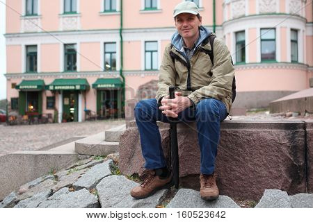 Tourist resting in the city center of Vyborg, Russia