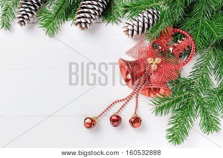 Christmas New Year composition with tangerines, cones, nuts, wicker basket and fir branches in rustic style on old wooden background, selective focus, Background new year, fir, gift, cones, orange, blue ball, red background, snow, ,