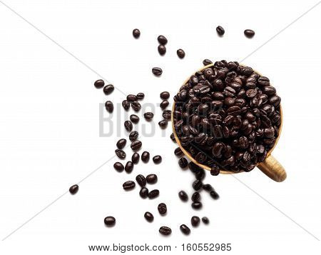 Top view roasted coffee beans in cup isolated on white background