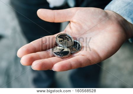 Georgian one lari coins in female hand. Traveling in Tbilisi Georgia concept