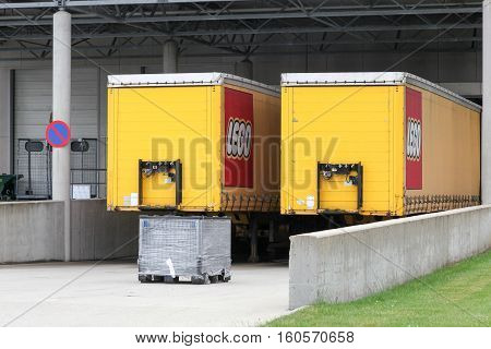 Billund, Denmark - May 14, 2016: Lego trucks and warehouse. Lego is a line of plastic construction toys that are manufactured by the Lego Group