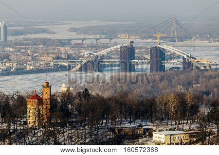 Top View of the Dnipro park and Podolsky bridge in Kiev, Ukraine  in winter day.