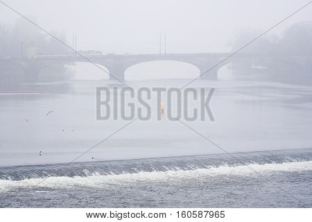 Panorama of an old Prague, bridges and embankment of Vitava river, Czechia