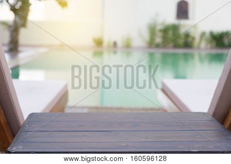 Wood Table And Pool Chair For Resting And Relaxing At Swimming Pool