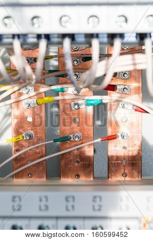 Connecting the wires with the bolts and nuts to the copper rails in the electrical Cabinet. A quality connection provides high security and durability ensures smooth operation of all components electrical Cabinet