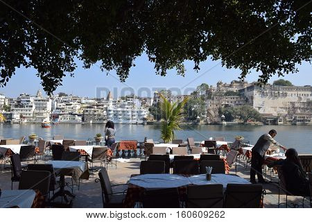 UDAIPUR, RAJASTHAN, INDIA, FEBRUARY 07, 2016 - Amazing view of Udaipur and lake Pichola from a terrace of a restaurant