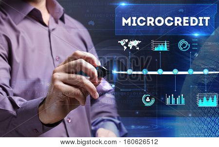 Technology, Internet, Business And Marketing. Young Business Person Sees The Word: Microcredit