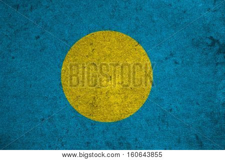 Palau Flag On An Old Grunge Background