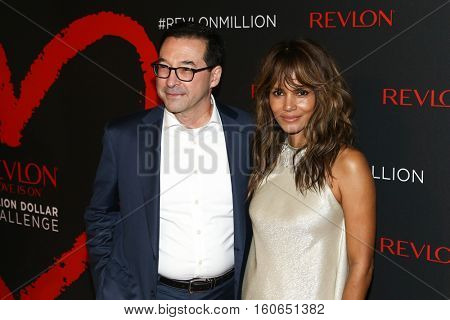NEW YORK-DEC 01: Revlon CEO Fabian Garcia (L) and Halle Berry attend Revlon's 2nd Annual Love Is On Million Dollar Challenge Finale Party at The Glasshouses on December 1, 2016 in New York City. 