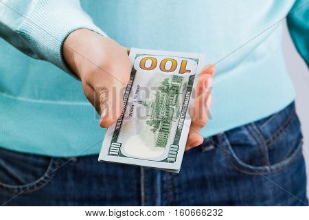 man holding hundred-dollar bills in his hands, money