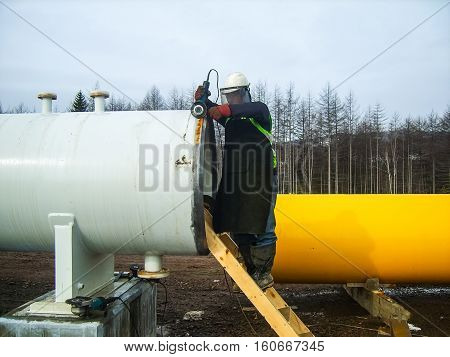 Safety at work. Welding and grinding of iron constructions. Industrial weekdays welders and fitters.