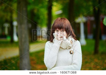 Young Girl In Warm Sweater On A Cold Autumn Day