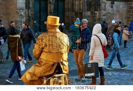Nuremberg Germany - November 29 2016: Living statue in the most famous Christmas Market in Nuremberg city Germany. Living statues are the entertainment for the tourists