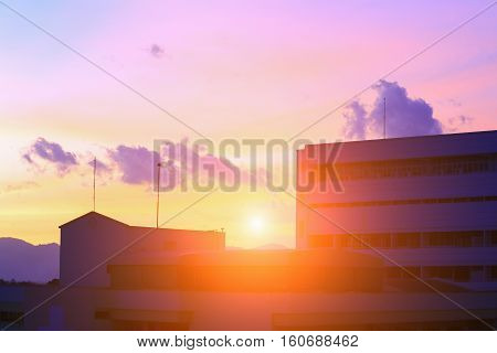 silhouette building in city and sun sky with color tone sunset beautiful colorful evening nature landscape twilight time