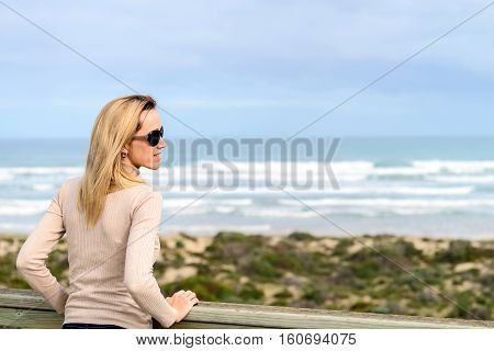 Woman enjoying the sea view at Goolwa beach South Australia
