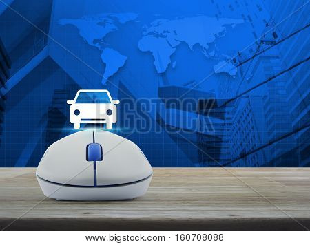 Wireless computer mouse with car front view flat icon on wooden table over world map and city tower background Internet service car concept Elements of this image furnished by NASA