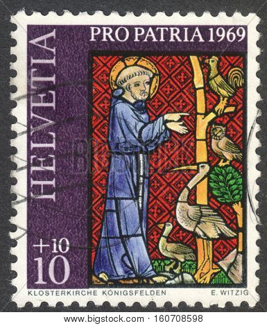 MOSCOW RUSSIA - CIRCA NOVEMBER 2016: a post stamp printed in SWITZERLAND shows Franciscus of Assisi preaching the birds the series 