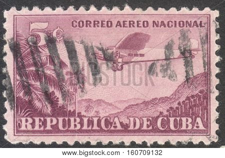 MOSCOW RUSSIA - CIRCA NOVEMBER 2016: a post stamp printed in CUBA shows a plane Airmail - For Domestic Use circa 1931