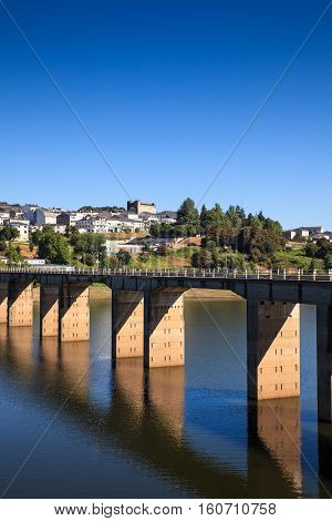 Roman bridge over the Minho River in Portomarin Spain