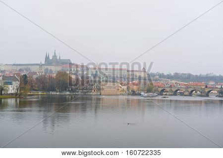 Panorama of an old Prague, bridges and embankment of Vitava river, Czechia