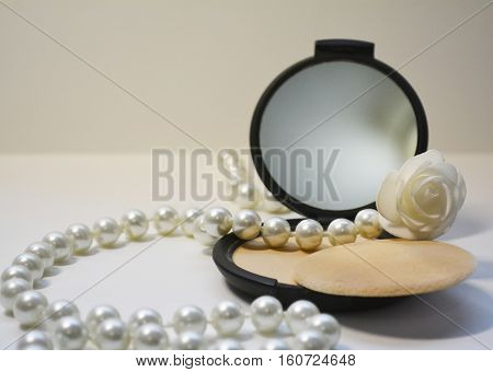 women's powder with mirror and beads from pearls