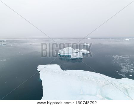 aerial view of the glaciers on arctic ocean in Greenland