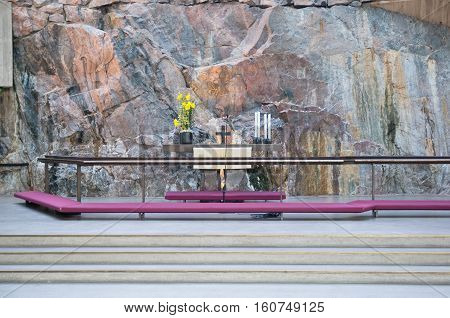 Helsinki, Finland - April 10, 2010:  Altar in the interior of Temppeliaukio Church (Church of the Rock) on Lutherinkatu. Was built directly into solid rock and opened in 1969