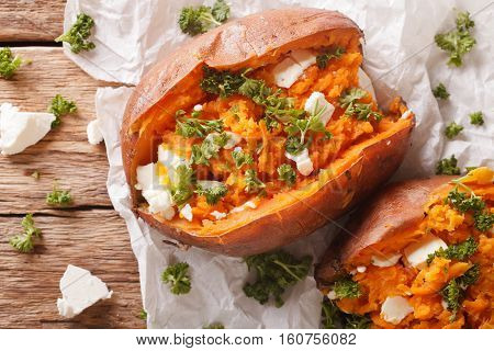 Healthy Food: Baked Sweet Potato Stuffed With Cheese And Parsley Close-up. Horizontal Top View