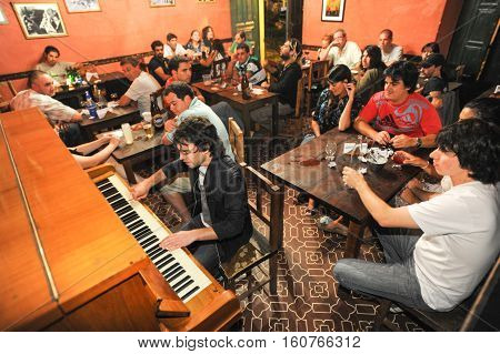 Salta Argentina - 21 February 2011 People listening at a music entertainment at the bar of La Casona on Salta Argentina