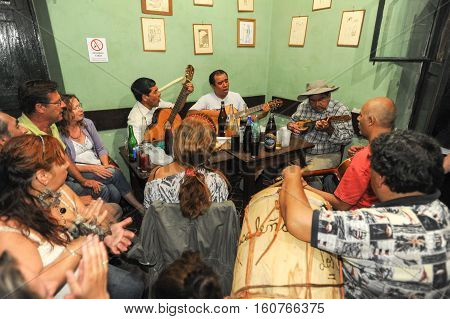 Salta Argentina - 21 February 2011 People listening at a music entertainment at the bar of La Casona on Salta Argentina