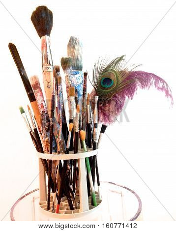 many art brushes in a bin for painting