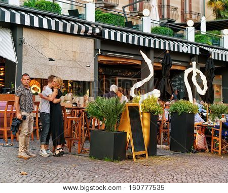 People Relaxing And Dining At Street Restaurants Of Ascona