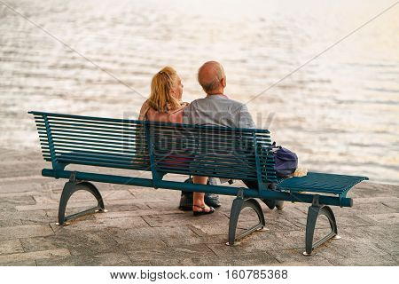Couple Sitting On Bench In Ascona Swiss