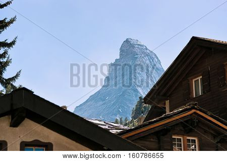 Roof Tops Of Chalets Of Zermatt With Matterhorn Mountain Switzerland