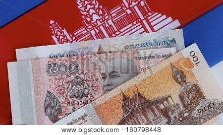 Cambodian riel currency and the Cambodian flag.