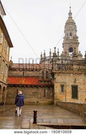 SANTIAGO SPAIN - AUGUST 16: Couple of tourists next to the Santiago cathedral on August 16 2016