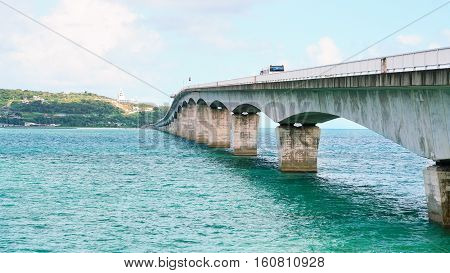 Sightseeing View of The Kouri Bridge with blue sky one of the very long bridge in Okinawa Japan