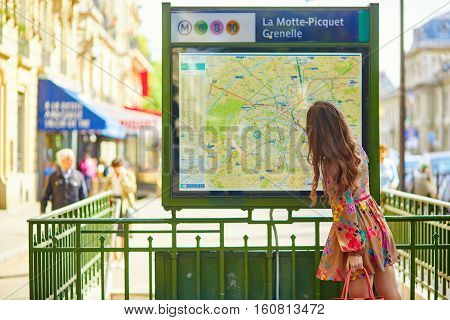 Parisian Woman Near The Subway Plan