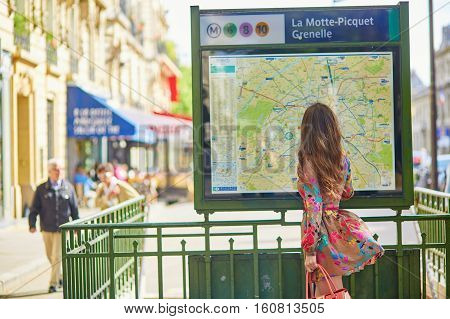 Young Parisian Woman Near The Subway Plan