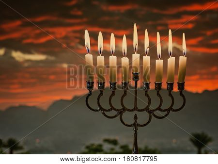 Jewish menorah with burning candles is traditional symbol for Hanukkah Holiday