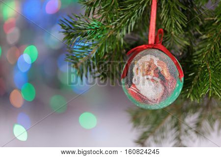 composition Christmas New Year Father Christmas toy on a green Christmas tree