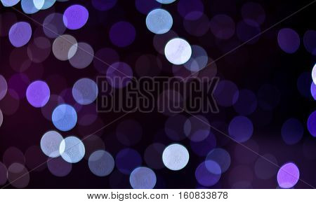 Christmas background. Festive abstract holidaysbackground with bokeh defocused lights and stars