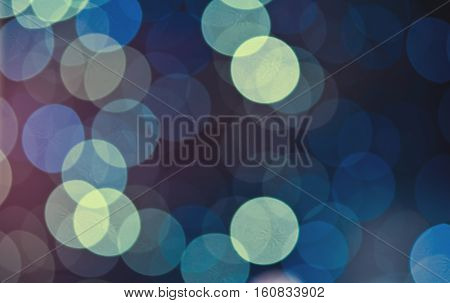 Christmas background. Festive abstract holidaysbackground with bokeh defocused lights and stars, toned