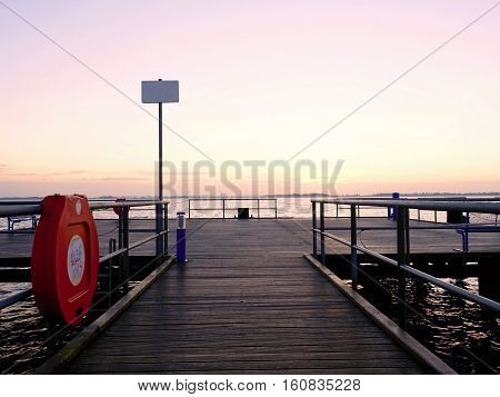 Long Touristic Mole Within Autumn Misty Morning. Wet And Slippery Wooden Floor,