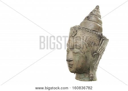 A traditional ornate Buddha head in serene Zen mediation pose. Connotations of calm peaceful contemplation and meditation leading to enlightenment. Against a white background with copy space.