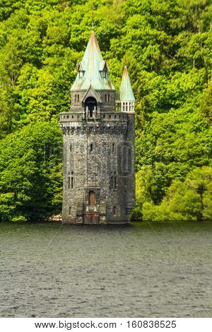 Gothic straining tower on Lake Vyrnwy reservoir. Powys Wales United Kingdom.