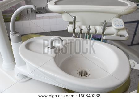 Sink medical equipment dentist Close up ceramic spittoon and water filler in Clinic